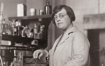 Black and white photo of Agnes Morgan in a lab coat
