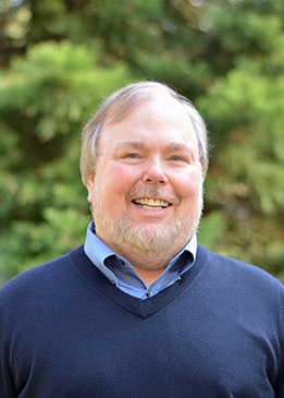 Greg Biging smiling.