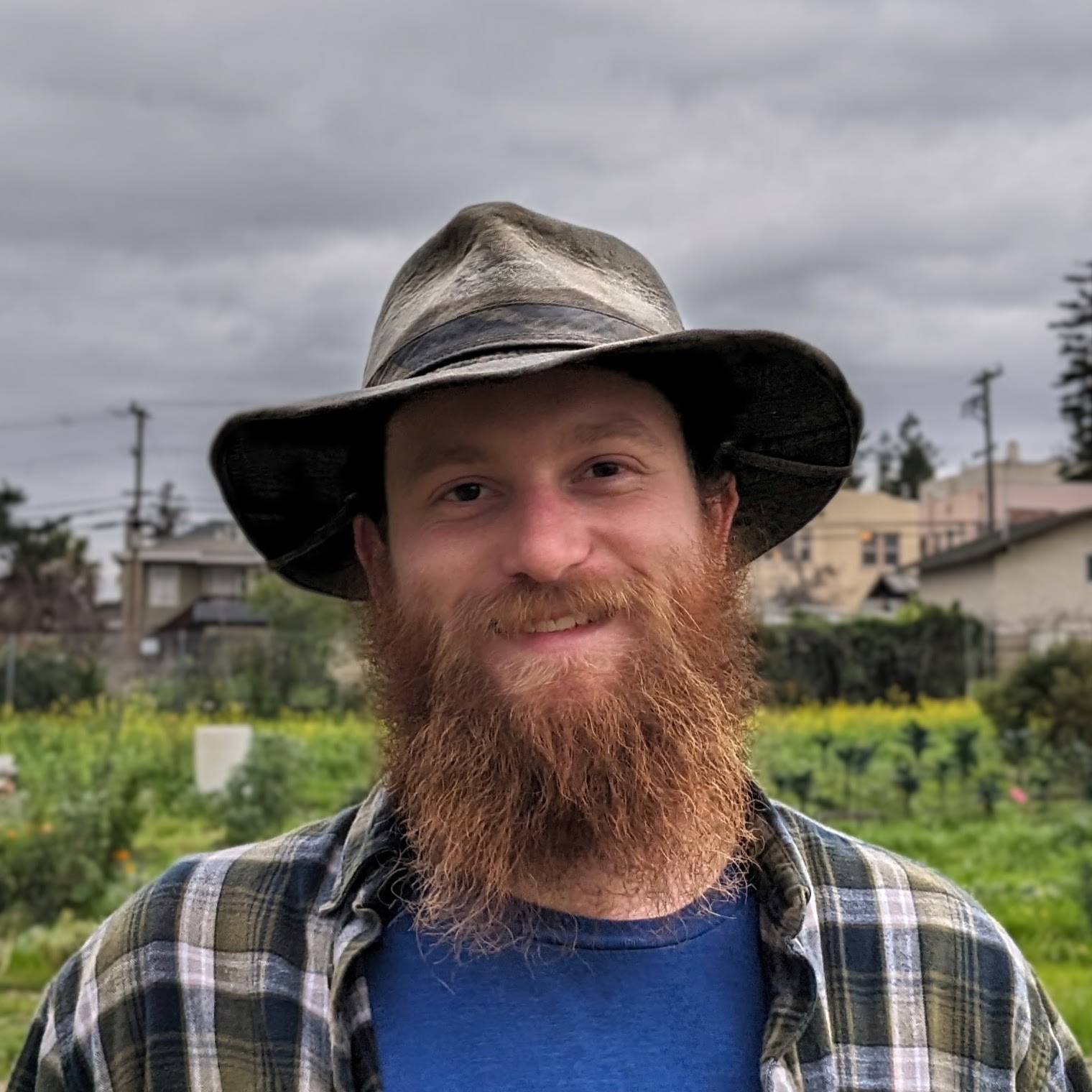 Headshot of Bradlee Mcanally in front of a field.