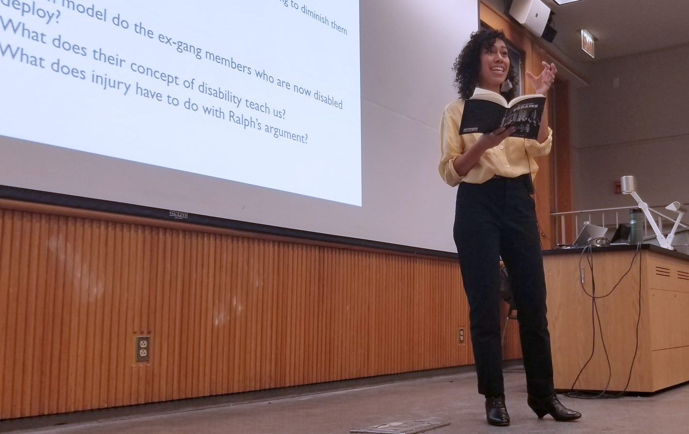 Lecturer Maryani Rasidjan on stage giving a lecture