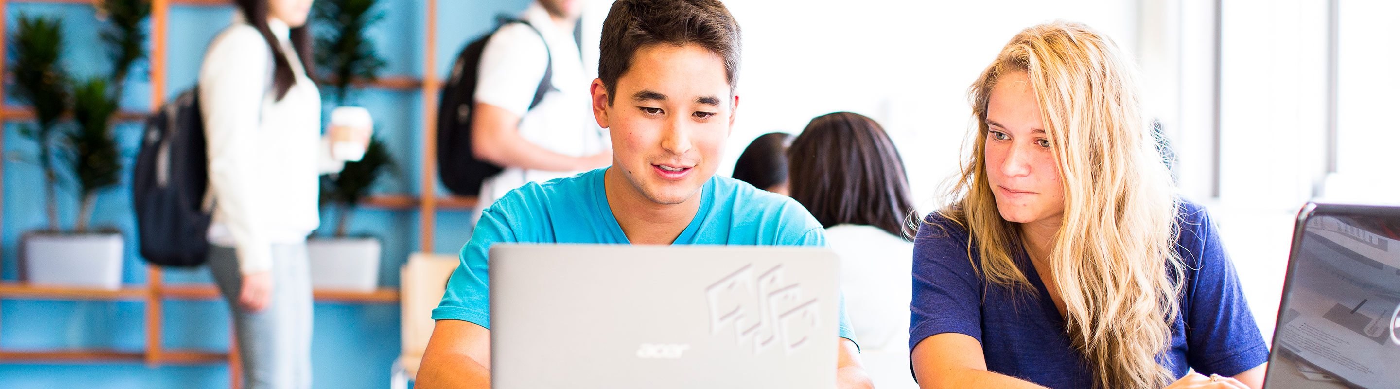 two students looking at a computer