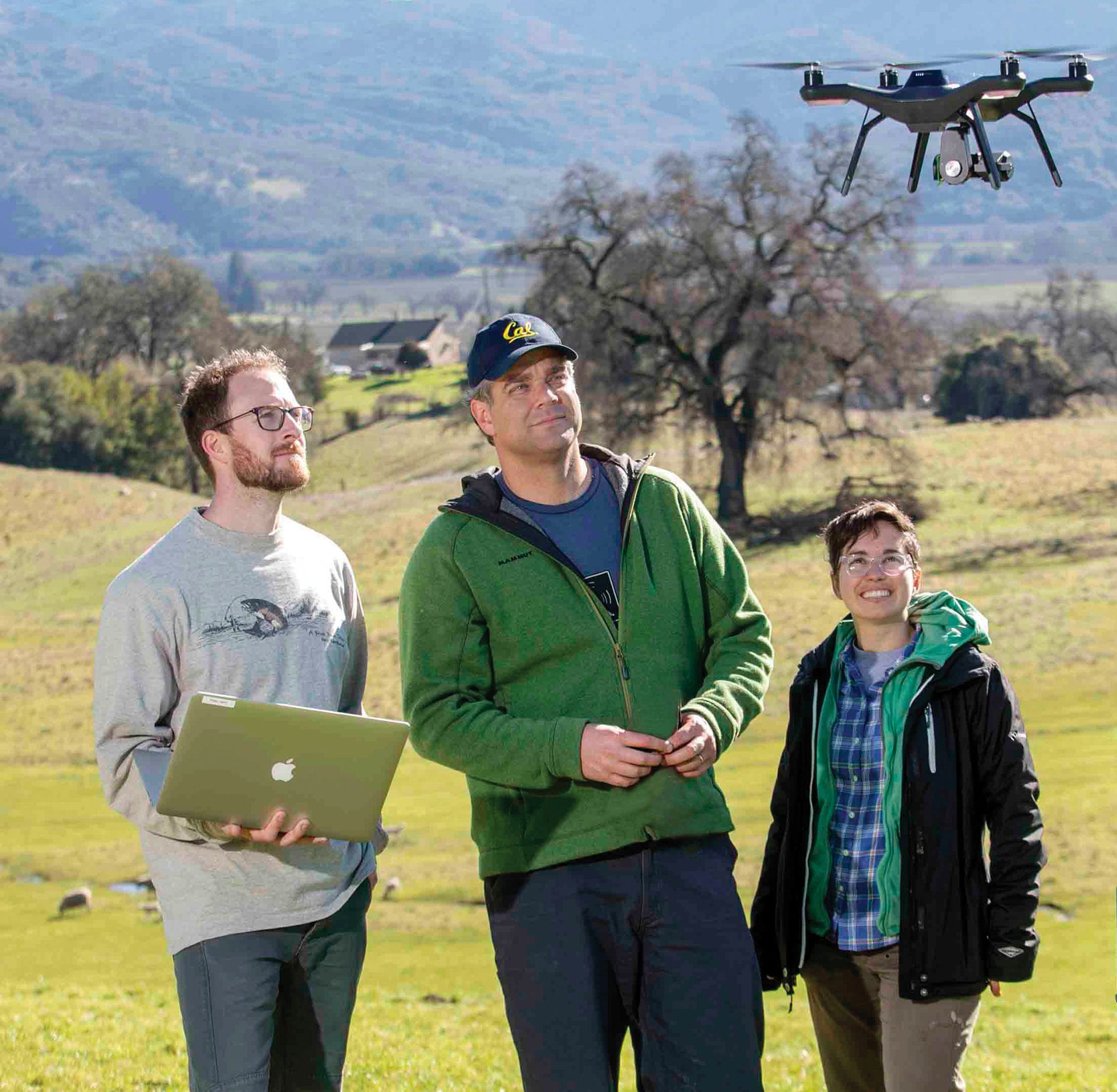 researchers with a drone
