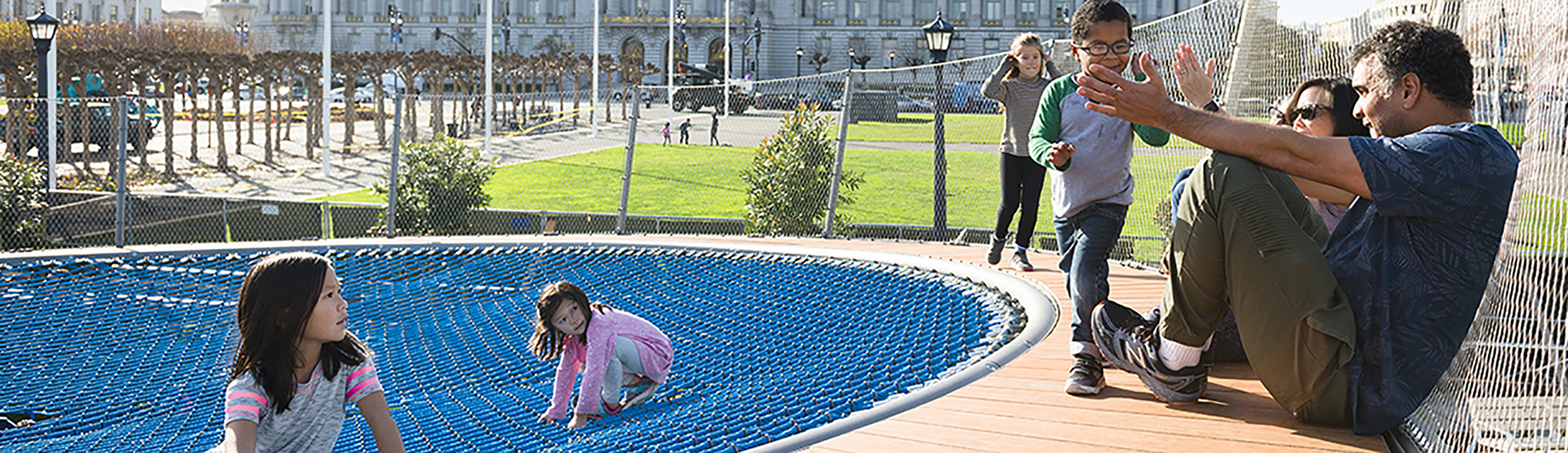 Family enjoying outdoor engagement in San Francisco's Civic Center