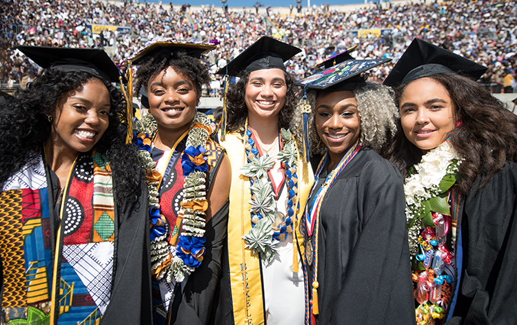 students in caps and gowns at commencement