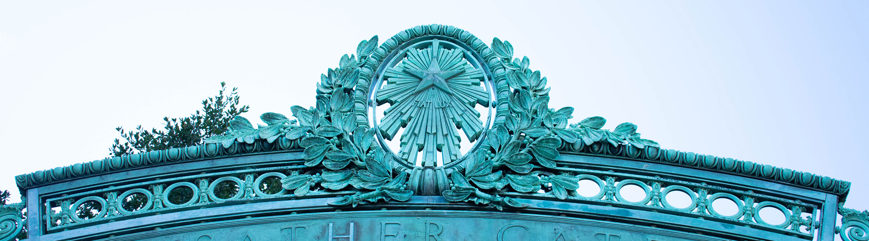 A bright photo of part of the Sather Gate on the UC Berkeley campus
