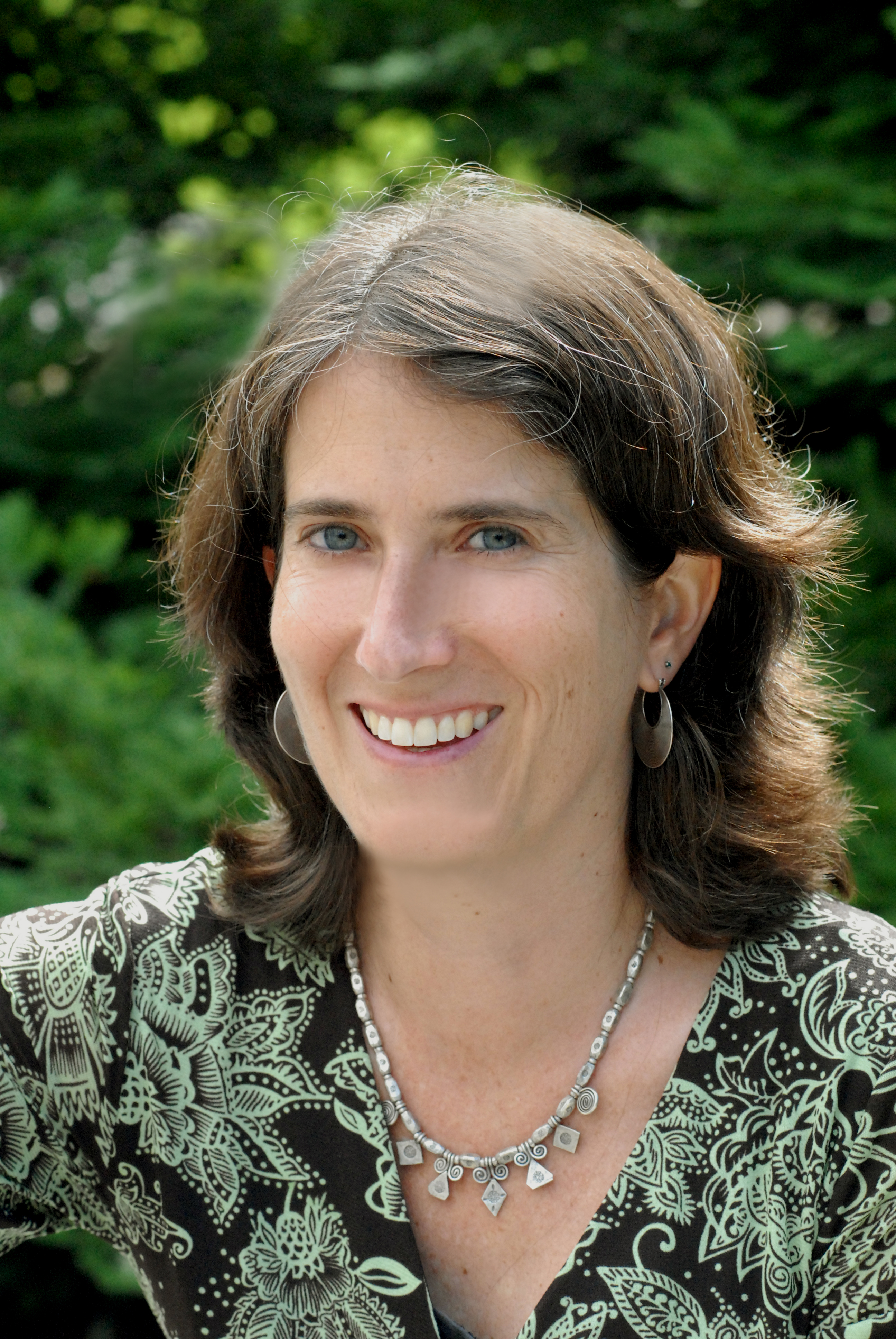 A headshot of Rachel Morello-Frosch outside in front of trees