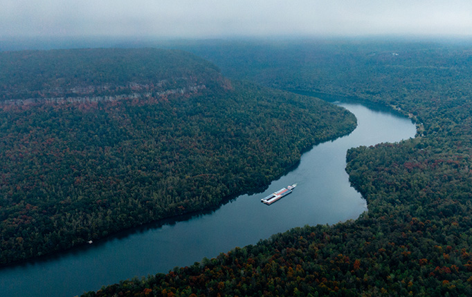 Aerial view of a river with a boat