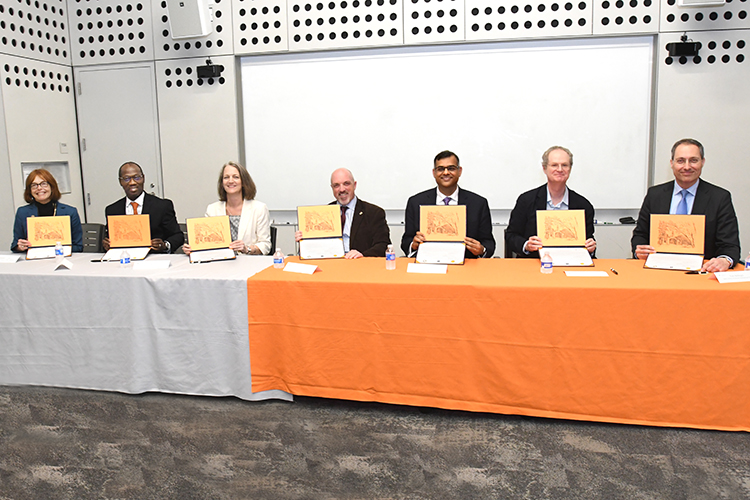 Attendees at a signing ceremony.
