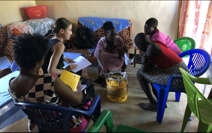 Annelise Gill-Wiehl studied the introduction of efficient cookstoves in Tanzania. Here, women gathered to hear about their advantages.