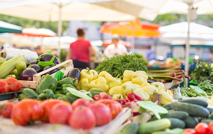 A photo of a spread of multicolored food and vegetables.