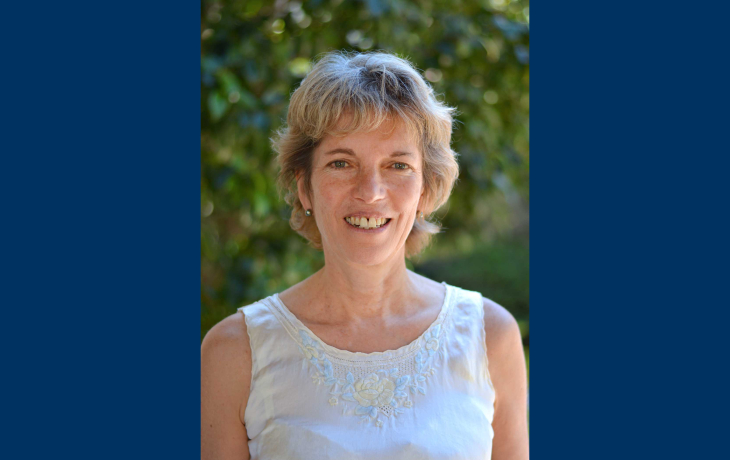 Rosemary Gillespie headshot on blue background