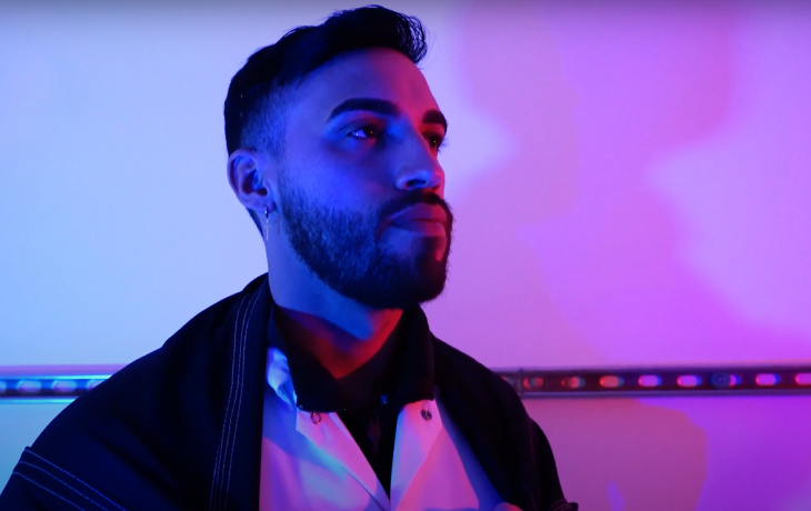 Luis Valentin-Alvarado headshot under neon lights.