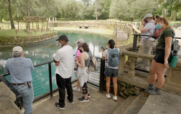 Visitors of The Society for Freshwater Science; visitors observing an outdoor exhibit