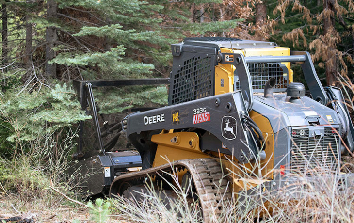 Tractor machine in forest