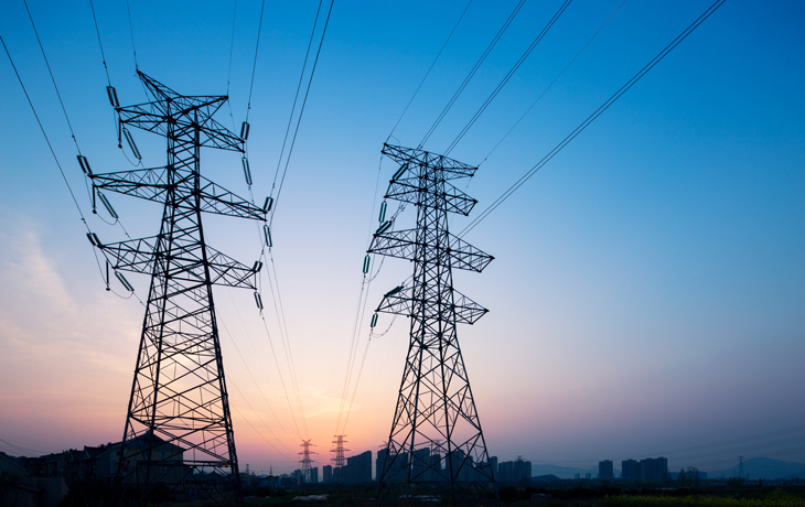 A photo of electric transmission lines at golden hour.
