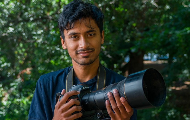 thumbnail image of Vishal holding a camera