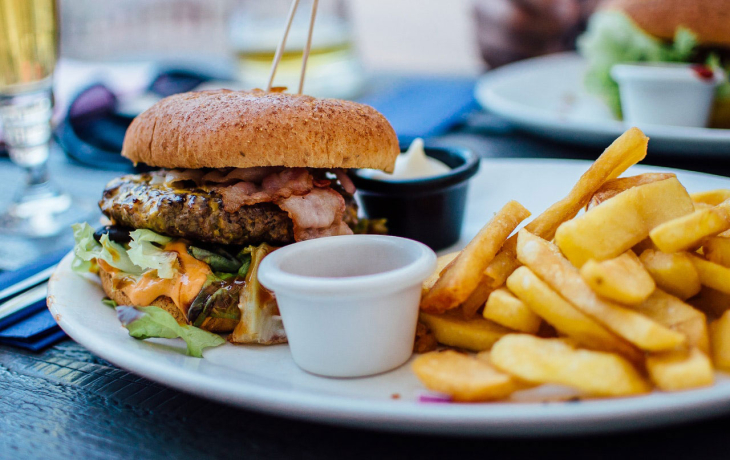 A plate with a burger and fries