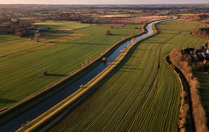 Water running through agricultural lands. 