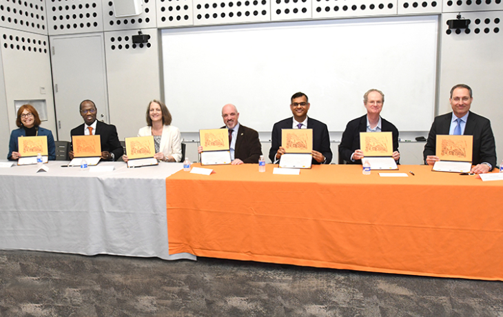 Attendees at a signing ceremony.