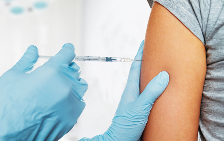 Medical professional giving a patient a shot