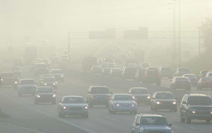 Cars at rush hour covered in smog
