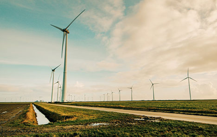 Photo of windmills on a hill.